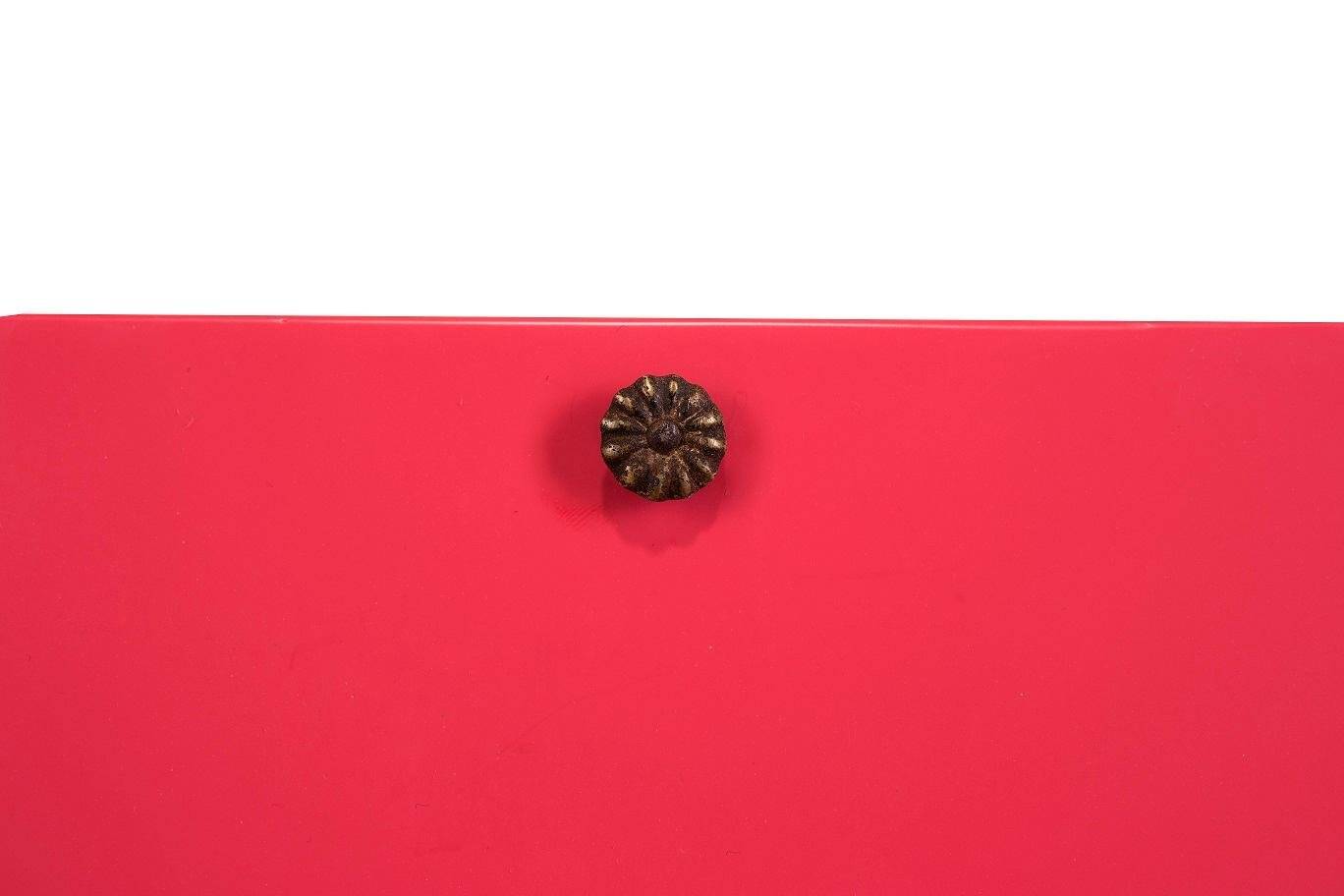 Large antique mirror with a solid wood frame painted turquoise and with red accents, mirror effect glass.