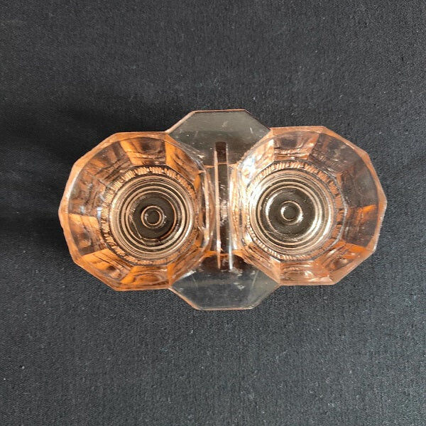 Salt shaker and pepper shaker in pink glass