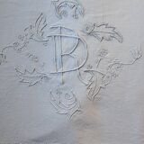 old linen sheet with monogram