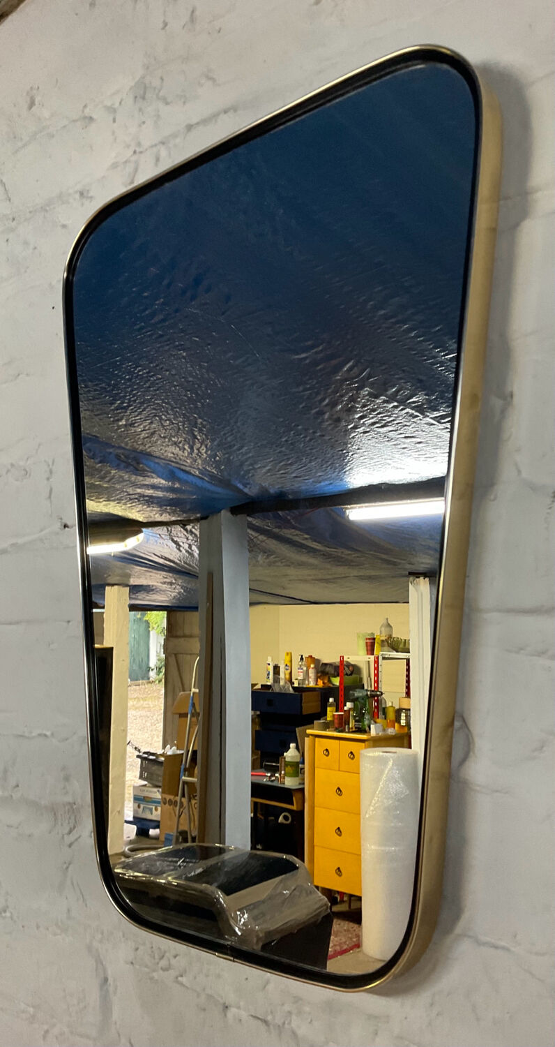 Asymmetrical free-form mirror from the 60s