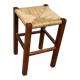 Low stool in brutalist style made of solid wood with straw, 1980.