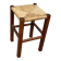 Low stool in brutalist style made of solid wood with straw, 1980.