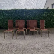 8 vintage 1970s chairs in brass and velvet with high backs.