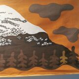 Beautiful wall-mounted Swedish fabric print with motifs of mountains, reindeer and more.