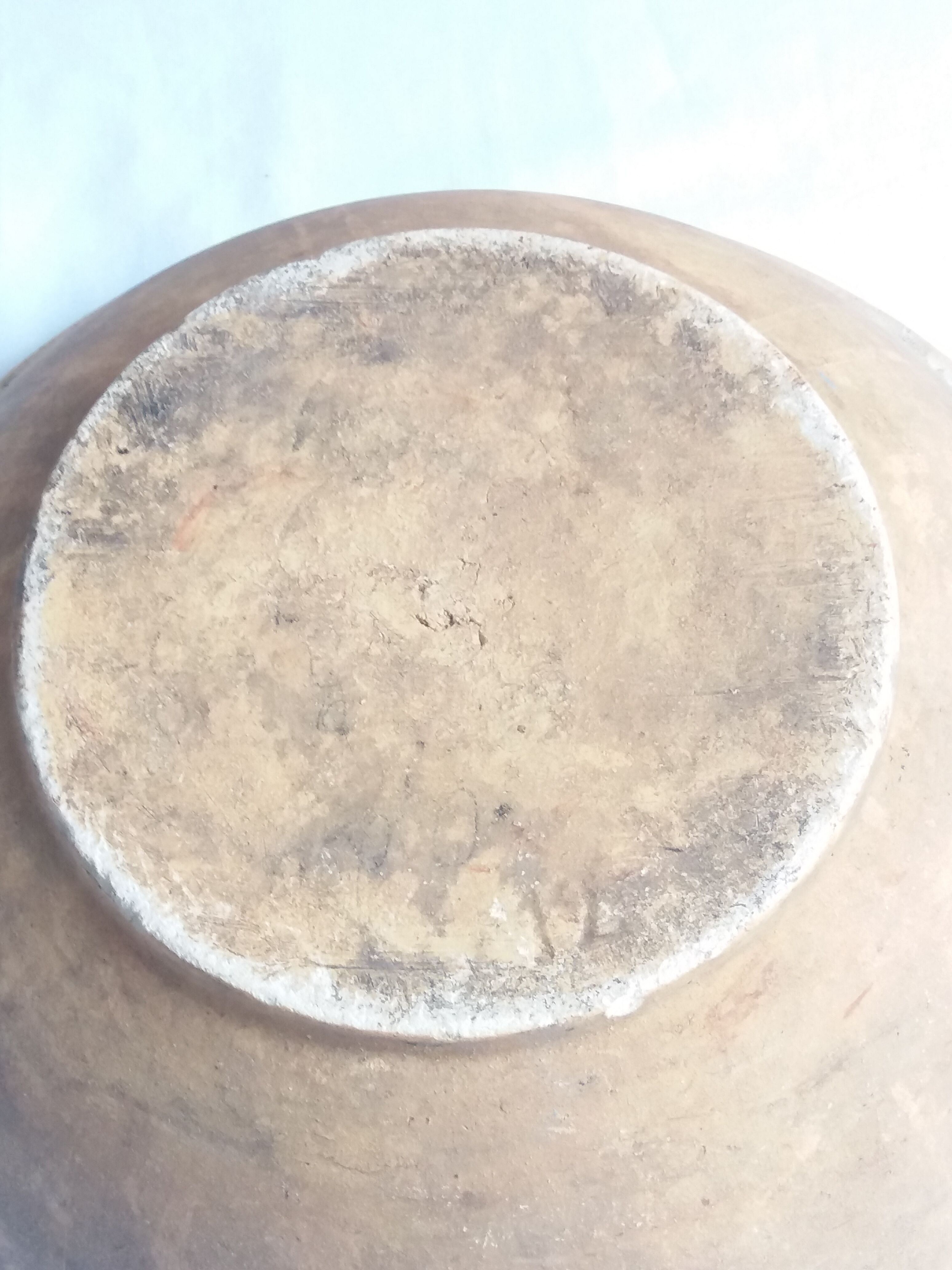 Large old salad bowl in yellow varnished earth