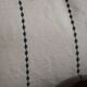 Embroidered linen cushion