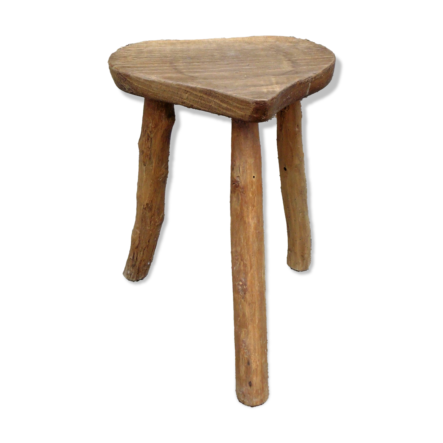 Farm stool in raw wooden sitting in the shape of a popular art