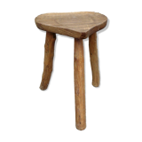 Farm stool in raw wooden sitting in the shape of a popular art