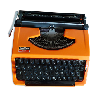 Vintage orange brother 210 typewriter