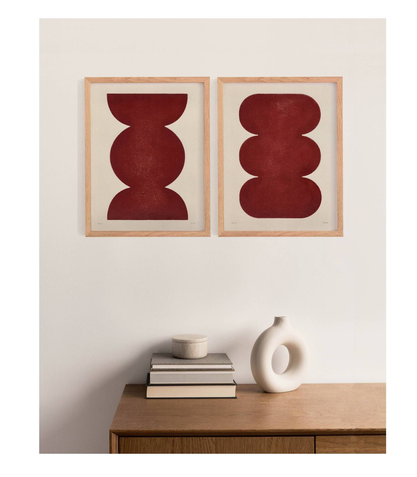 Duo of abstract paintings in burgundy on paper signed Eawy.