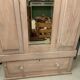 Antique English wardrobe in pale pink patina.