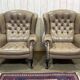 Pair of high-backed Chesterfield armchairs with 1 leather footrest