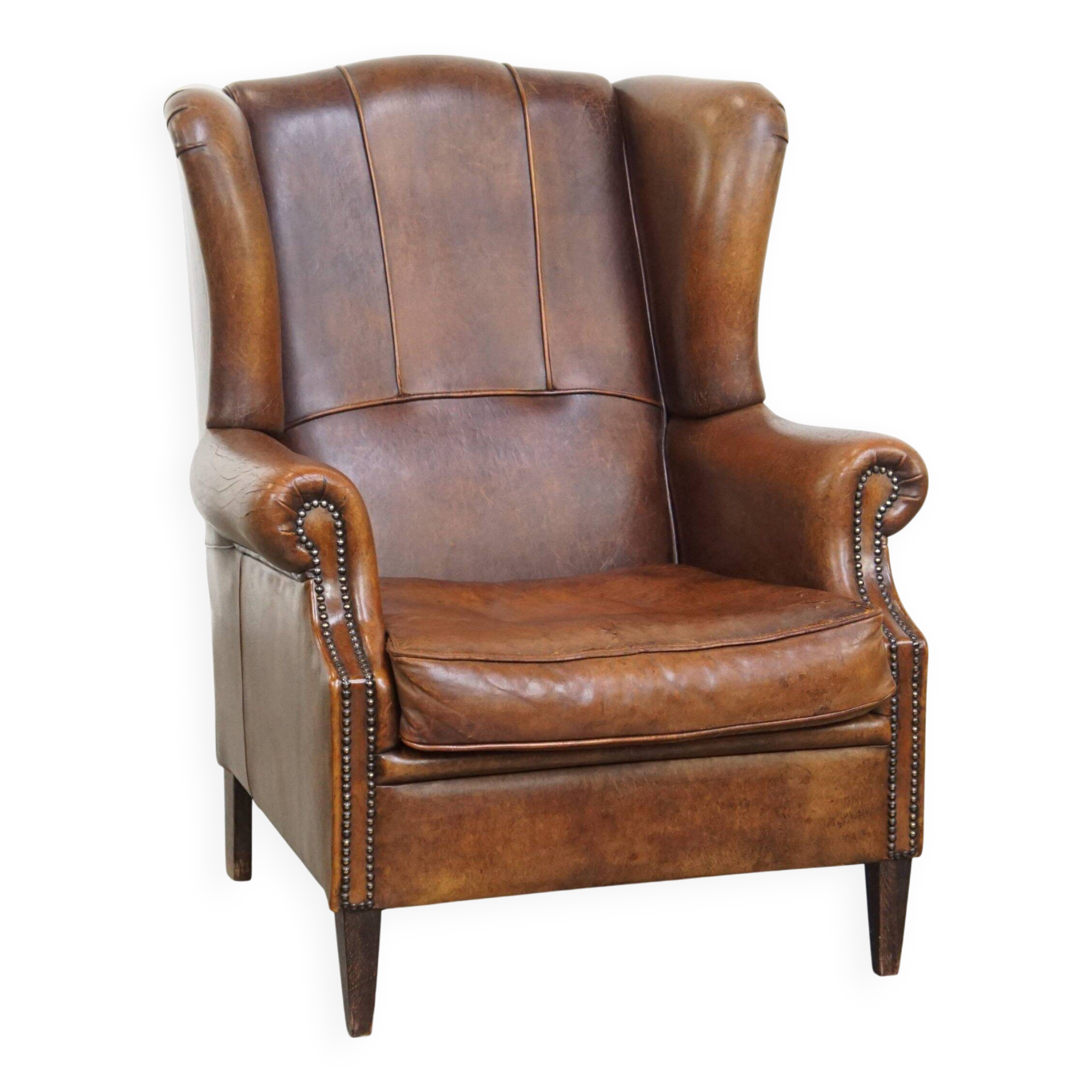 Sheepskin wingback chair in good condition