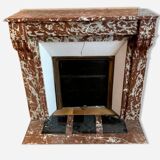 Red marble fireplace with modillion