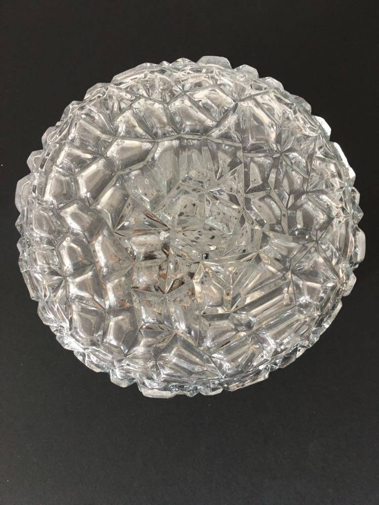 Round ceiling or wall lamp in worked glass. Gray metal support