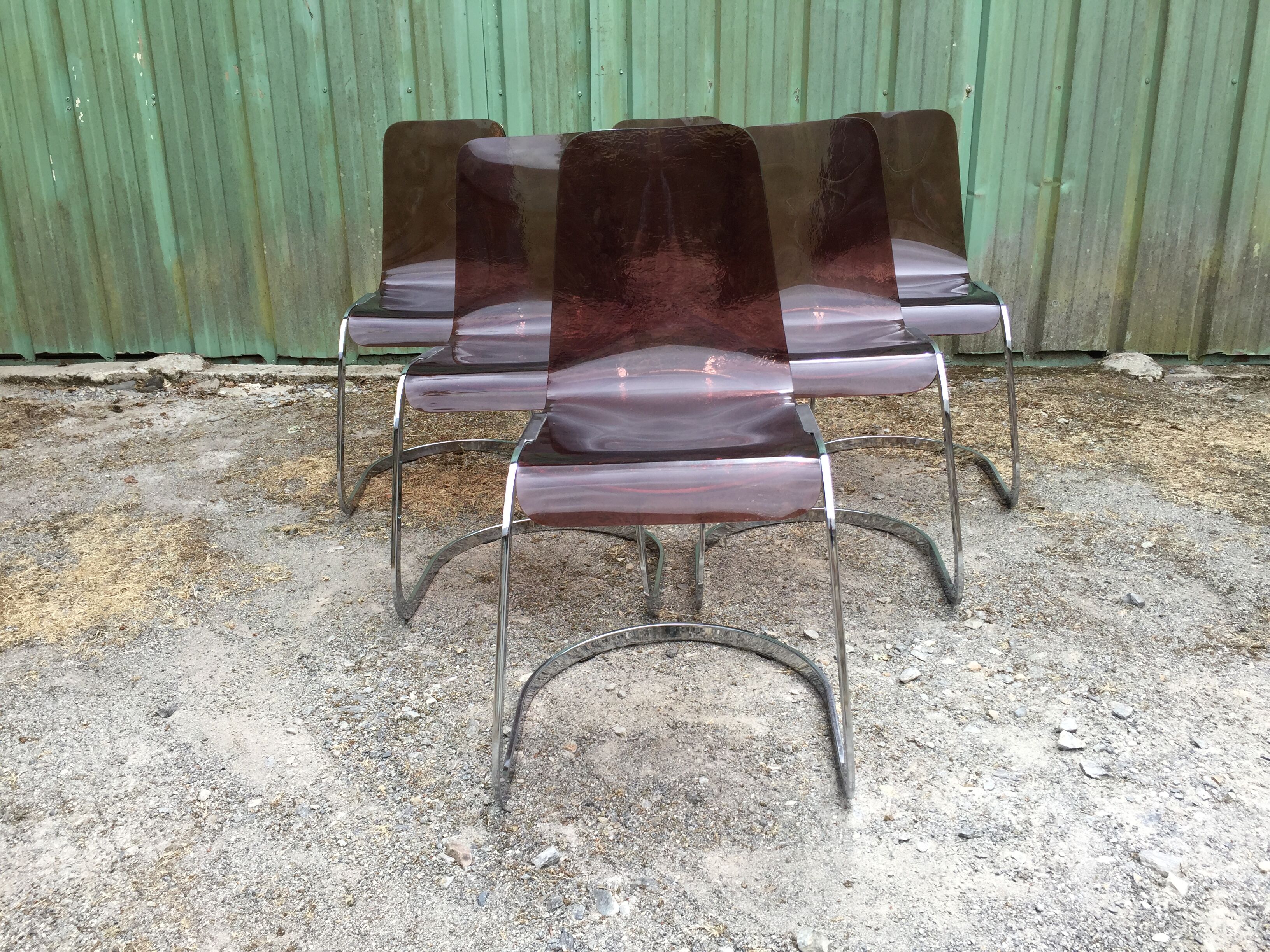 Chairs in plexiglas with chrome metal base