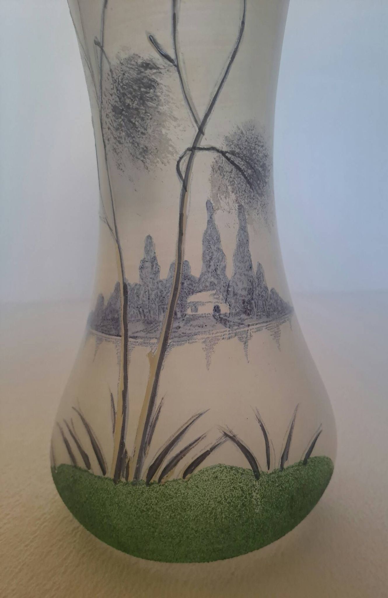 Frosted glass vase enhanced by hand