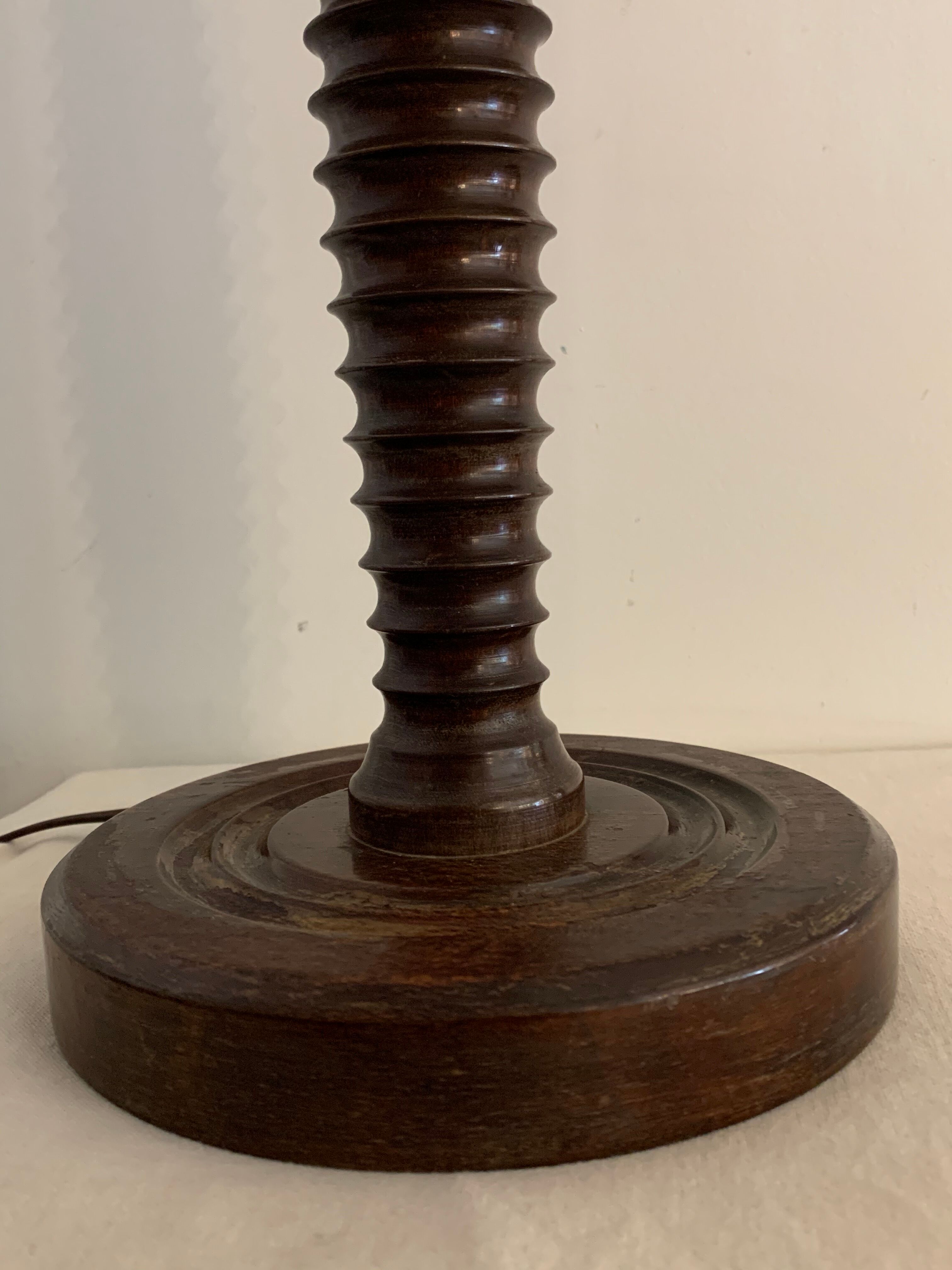 Turned wooden lamp foot in the shape of a warhead