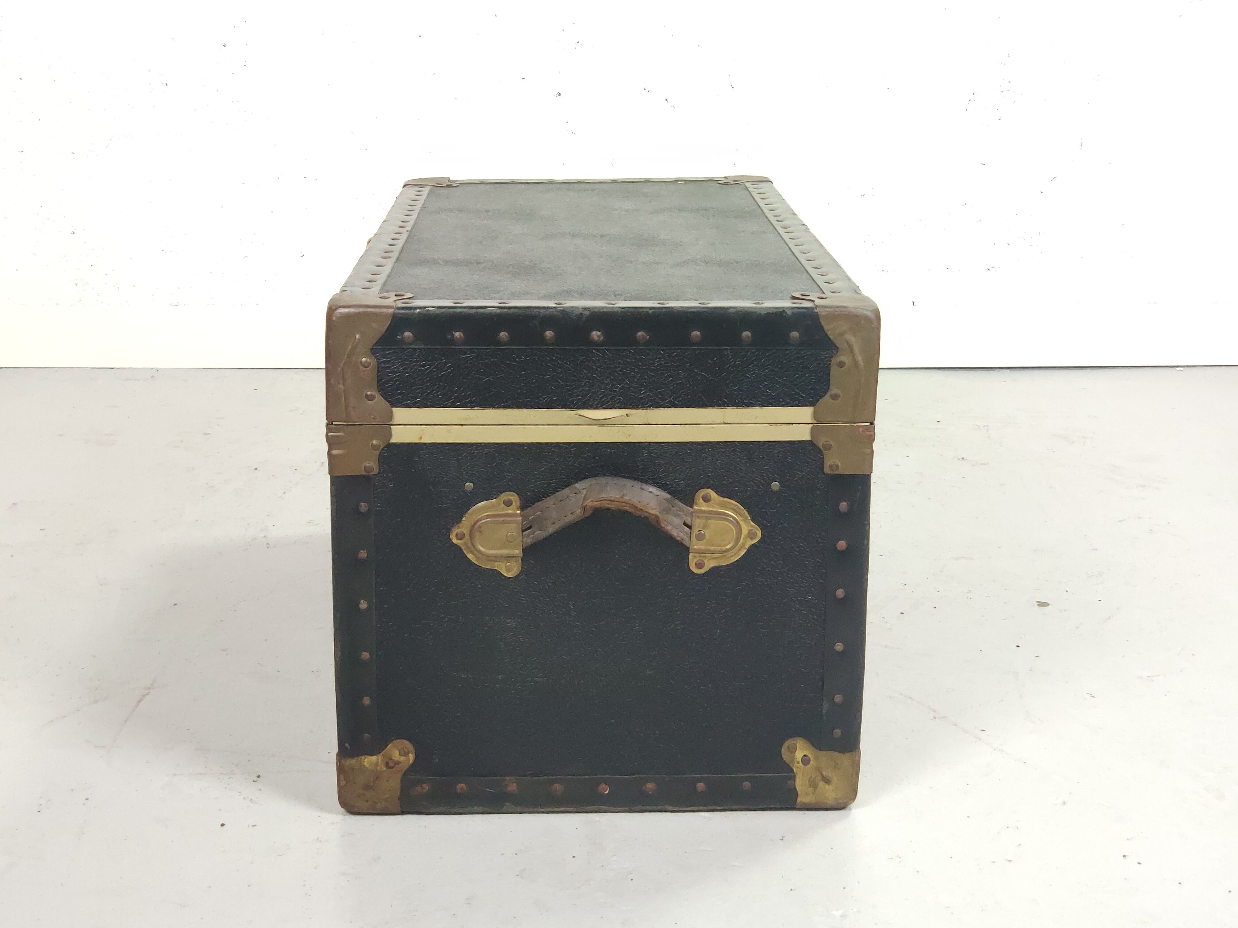 Old black trunk and brass