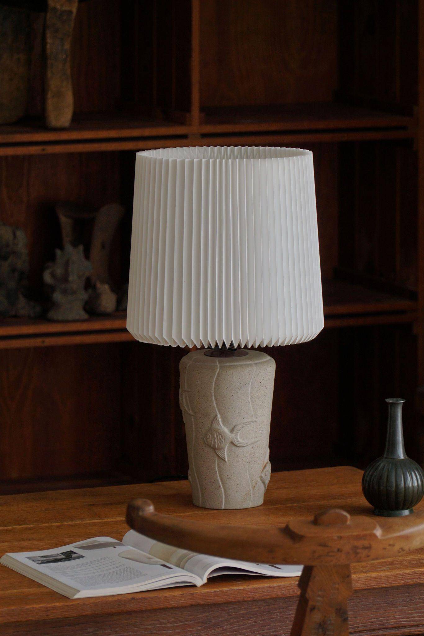 Modern vintage French table lamp, made of stone with fish patterns, 1970s.