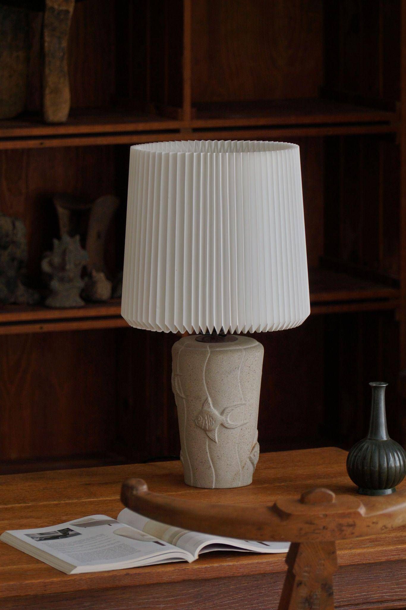 Modern vintage French table lamp, made of stone with fish patterns, 1970s.