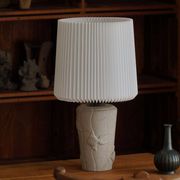 Modern vintage French table lamp, made of stone with fish patterns, 1970s.