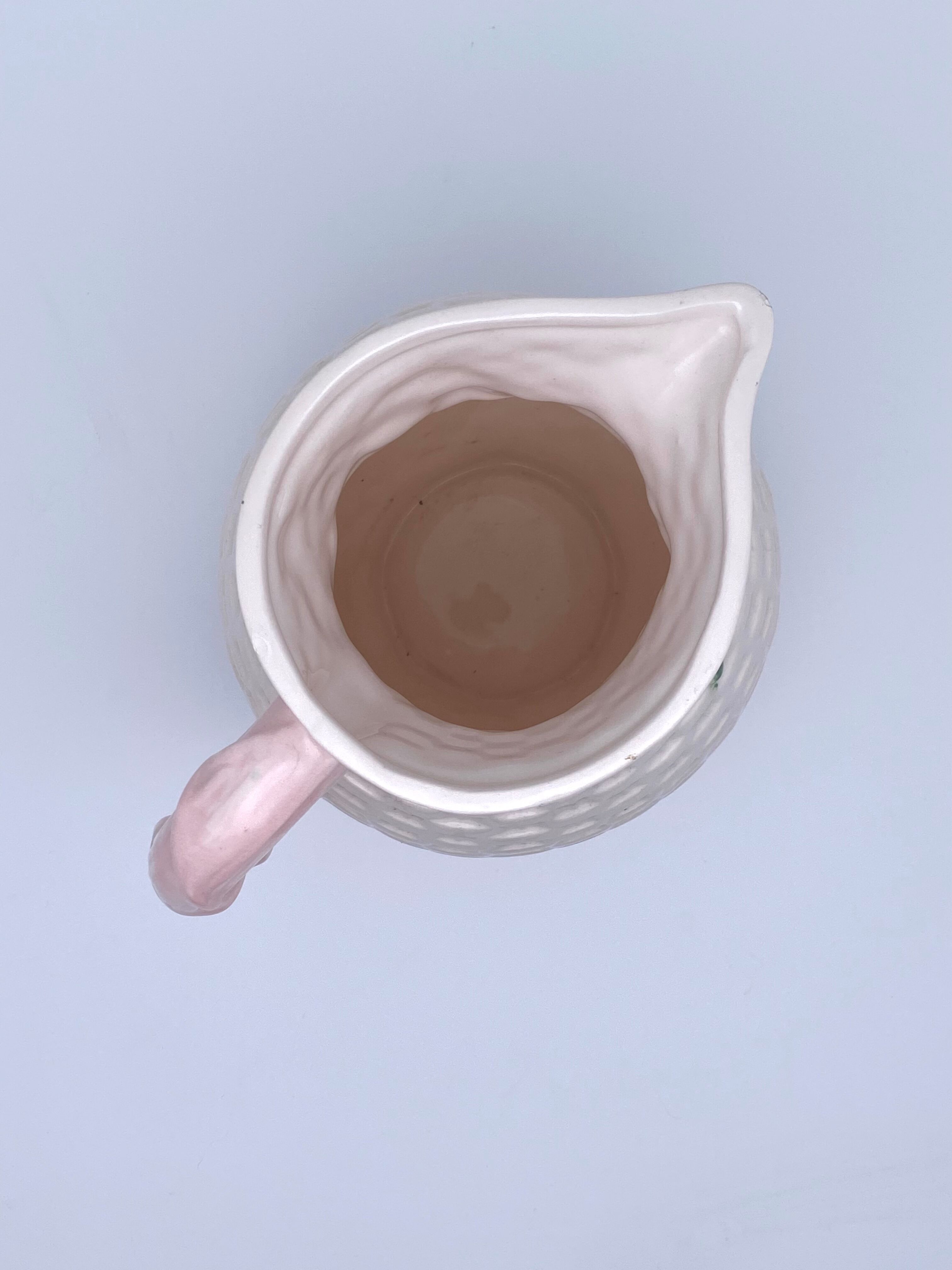 Pale pink slip decanter and colorful fruist