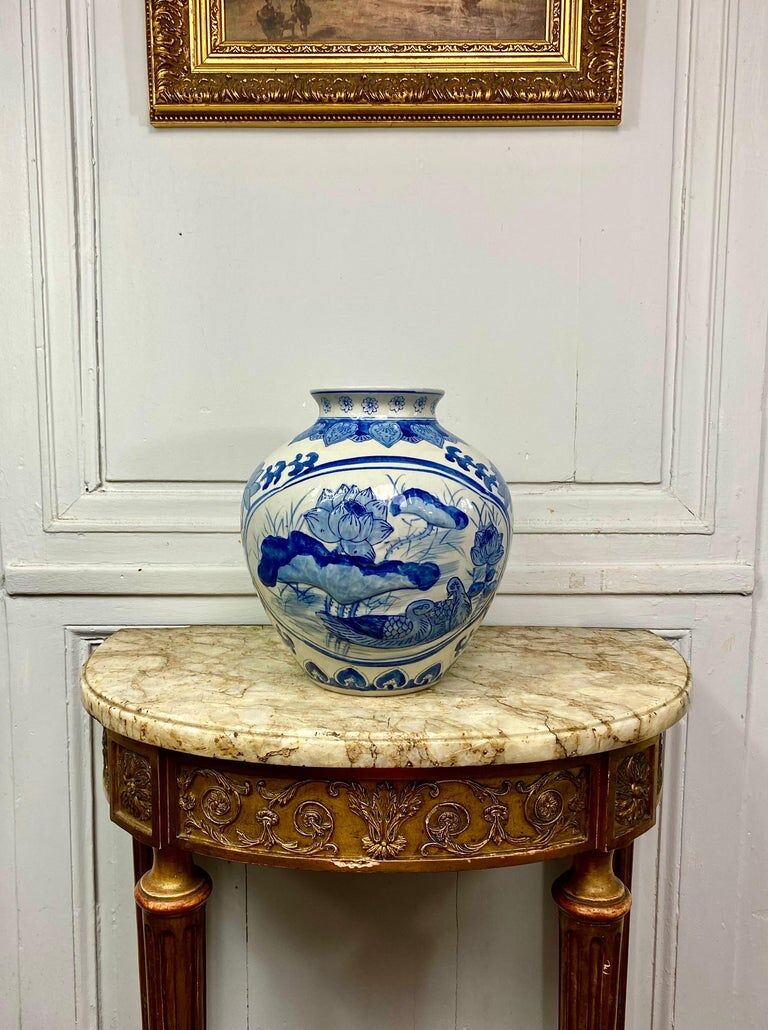 Chinese vase in blue-white porcelain decorated with lotus flowers