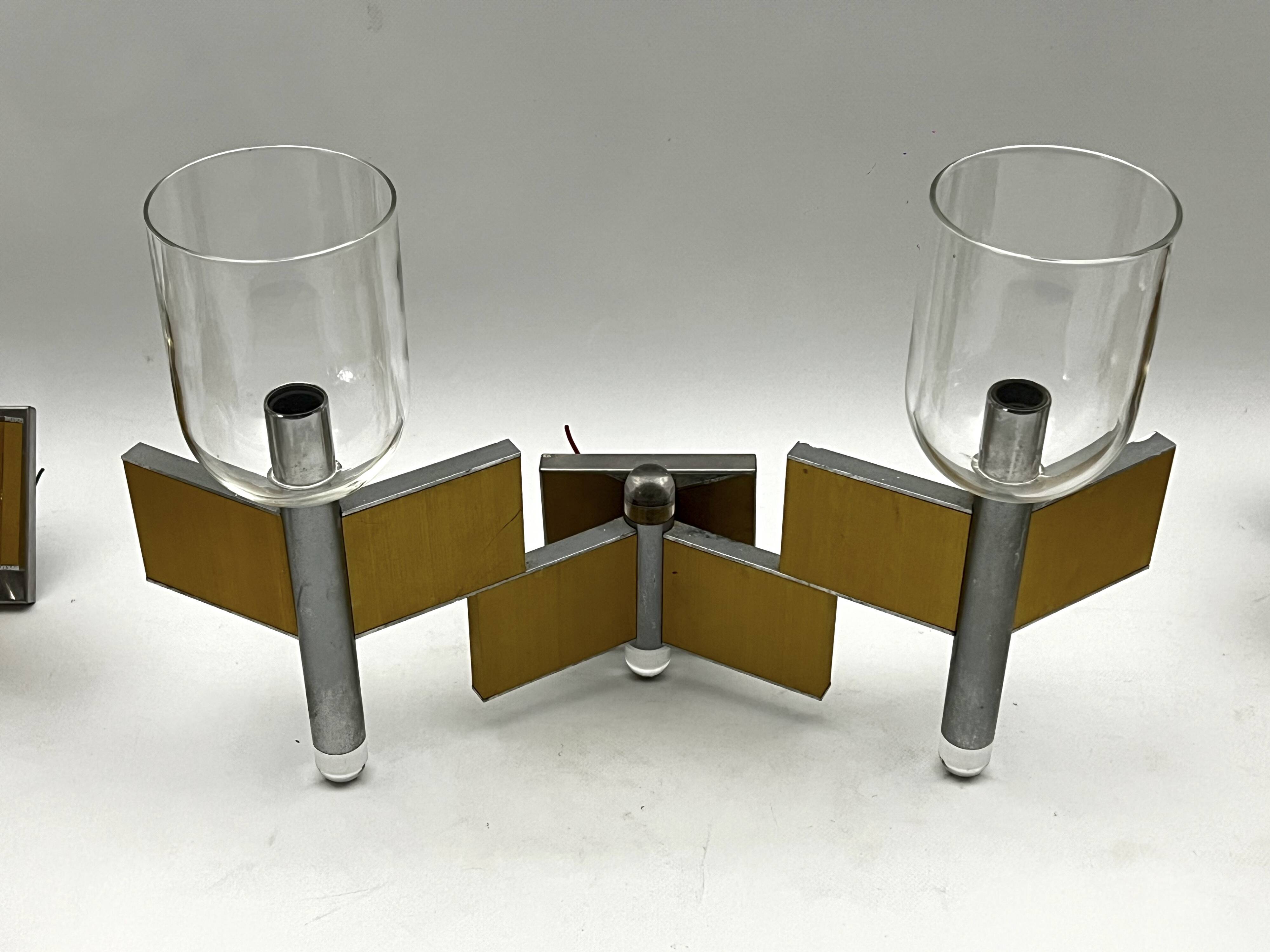 Mid-Century Modern set of eight brass and chrome sconces by Sciolari. Italy 1970s