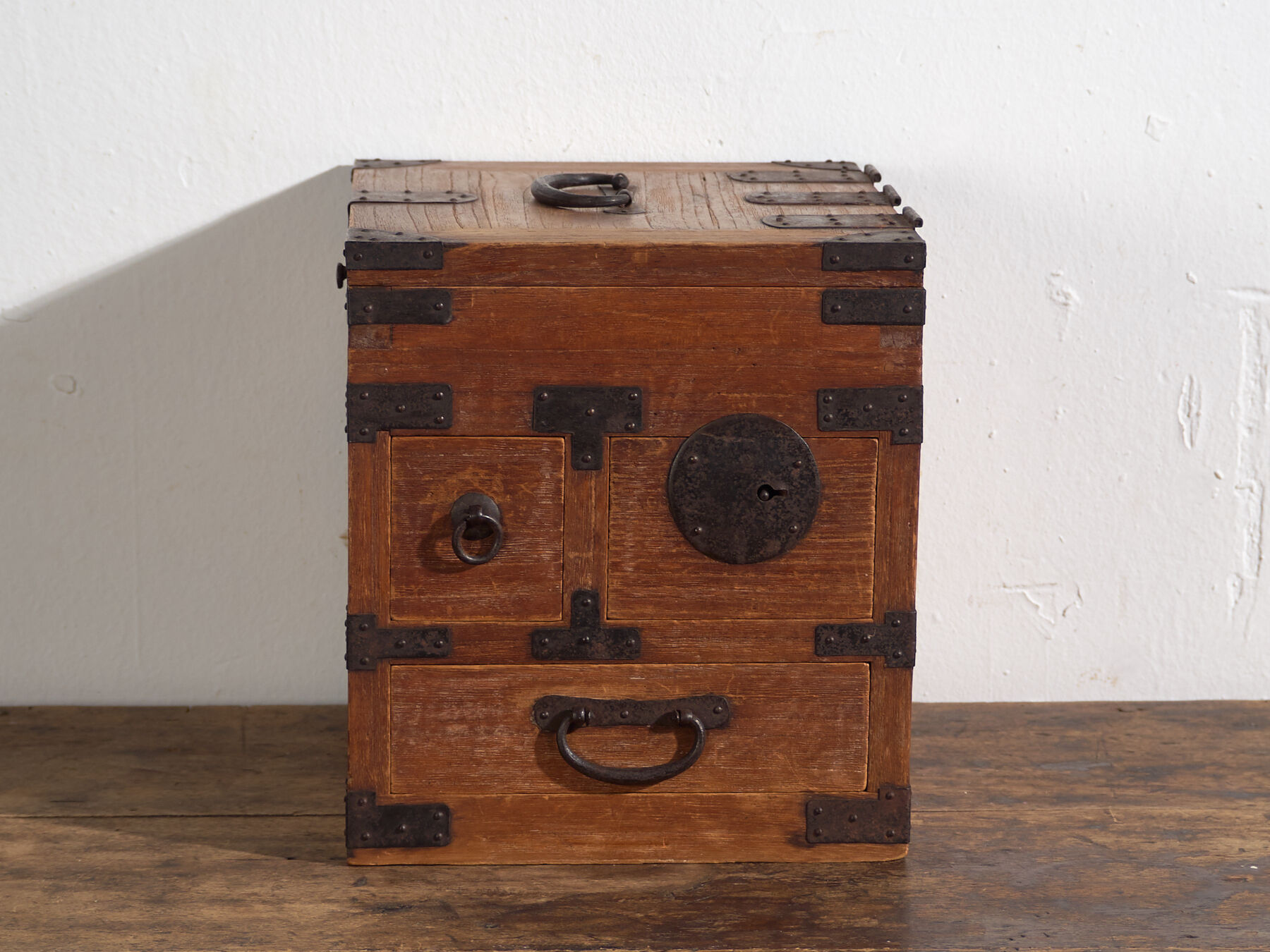 Japanese ko-dansu with hinged lid and paulownia wood drawers, Meiji–Taishō period, circa 1868–1926.