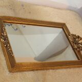 Small rectangular mirror in gilded wood with a pediment decorated with flowers