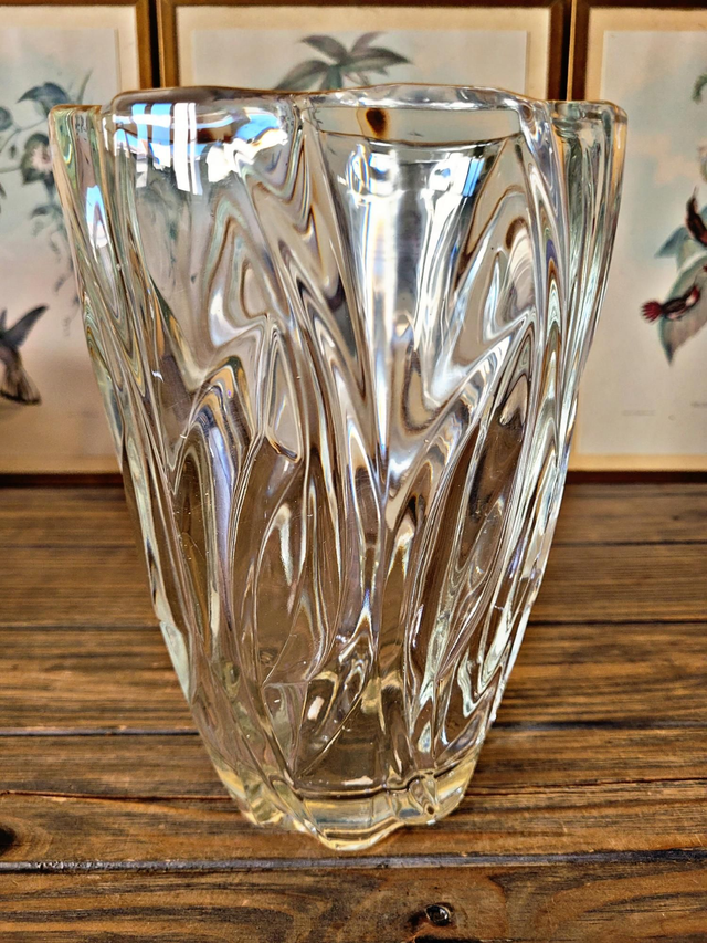 Vintage thick glass vase with twisted ribbed relief.