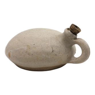 Old round sandstone hot water bottle