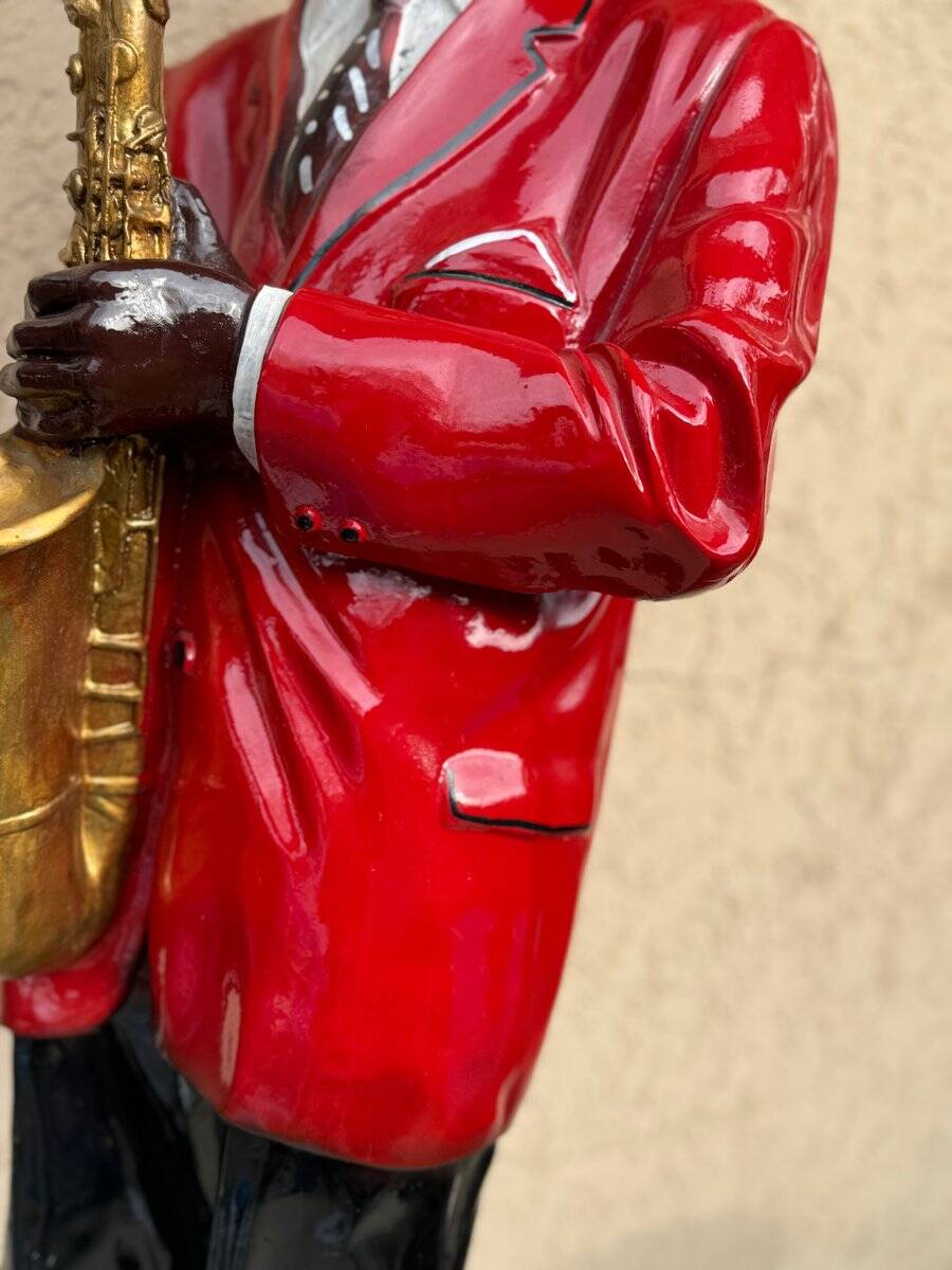 Large black and red jazz figurine in fibreglass, decorative sculpture from the 1960s.