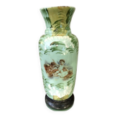 Green opaline vase decorated with painted and enamelled cherub motifs.