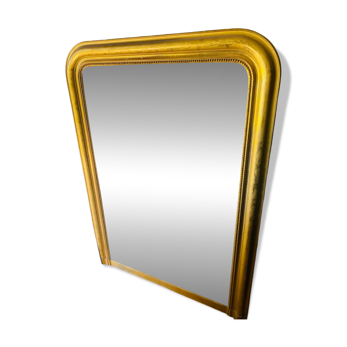 Large antique mirror with gold leaf in the Louis XV style.