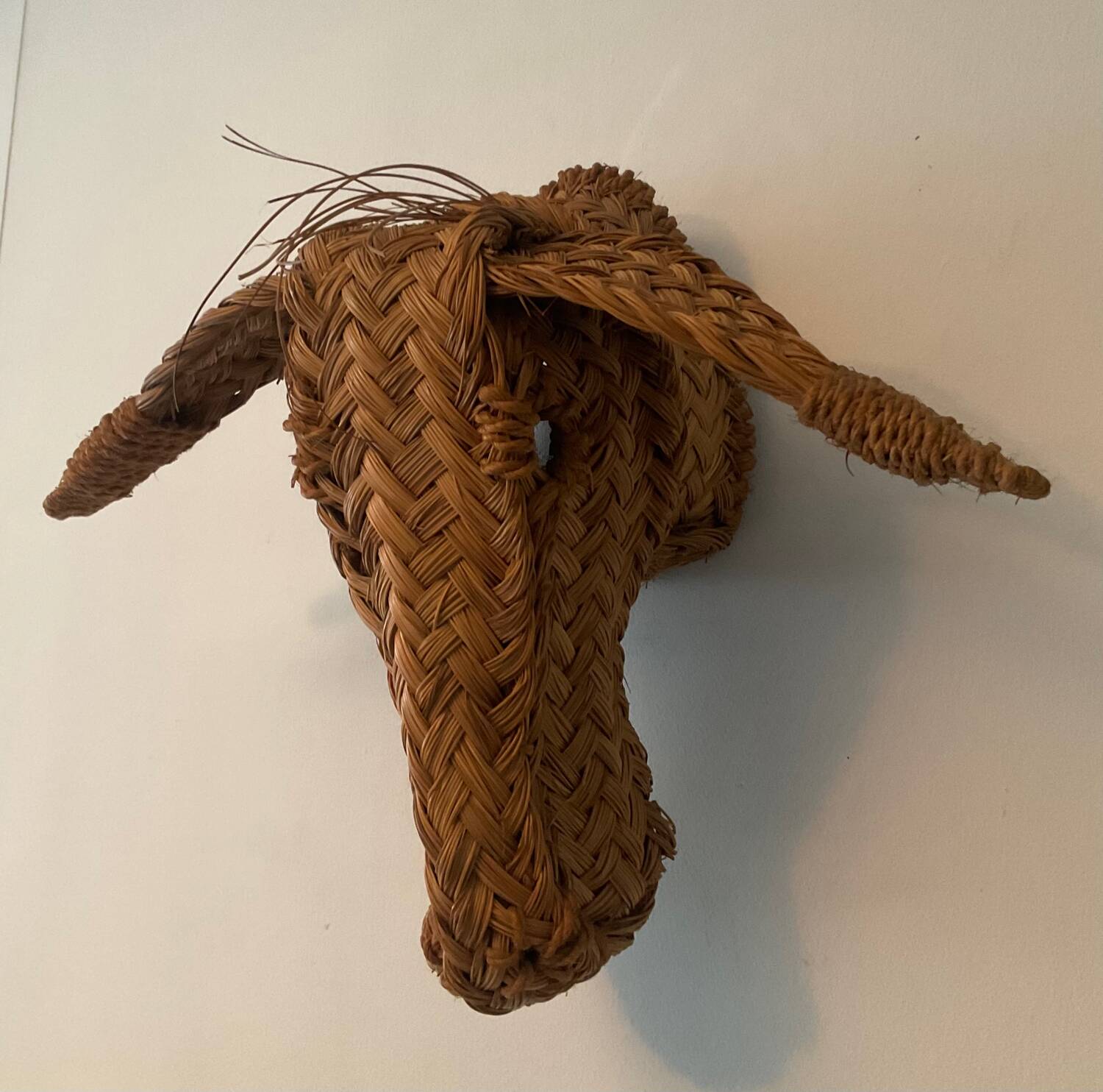 Vintage donkey head in raffia and wicker