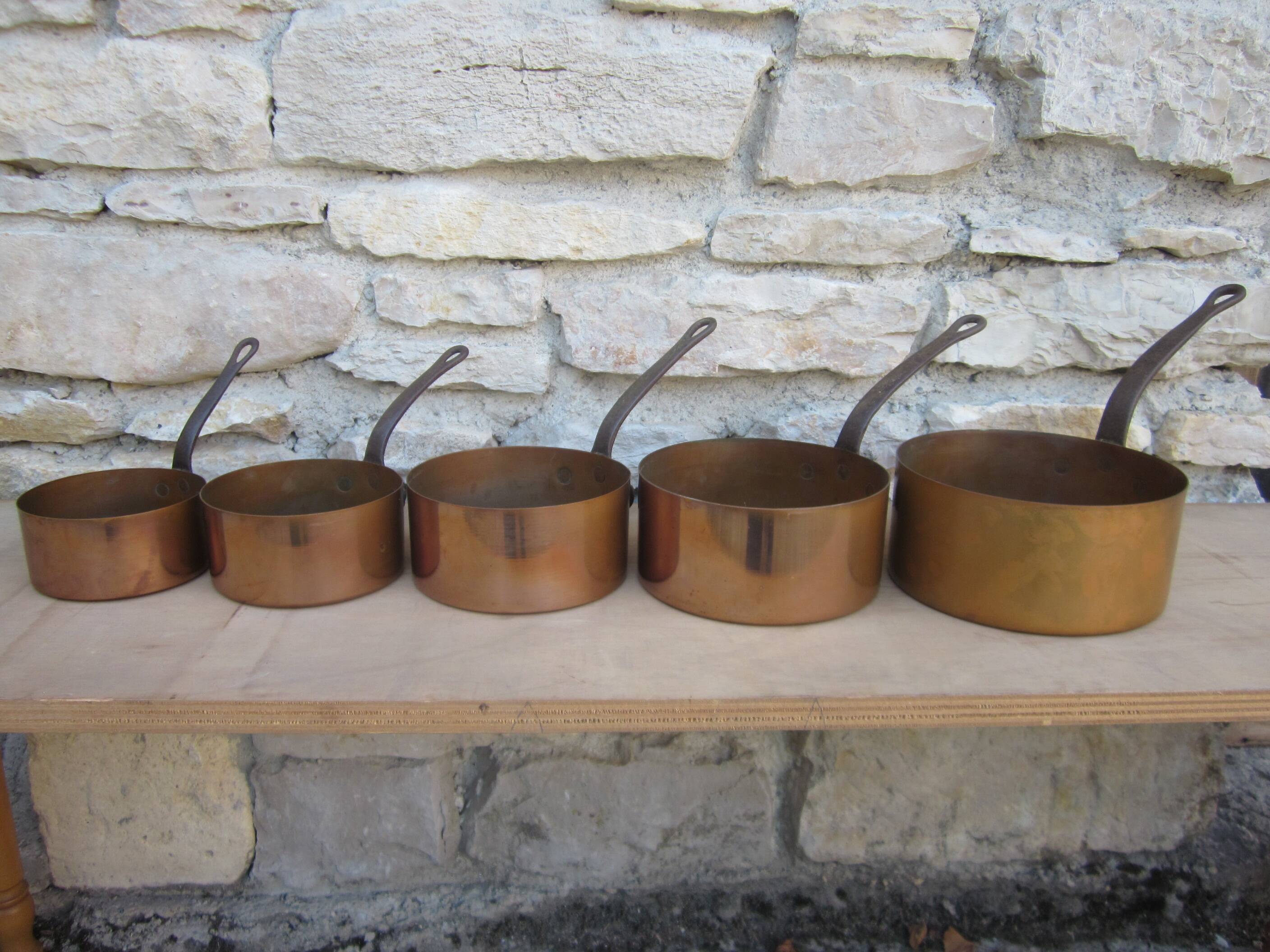 Set of 5 copper saucepans