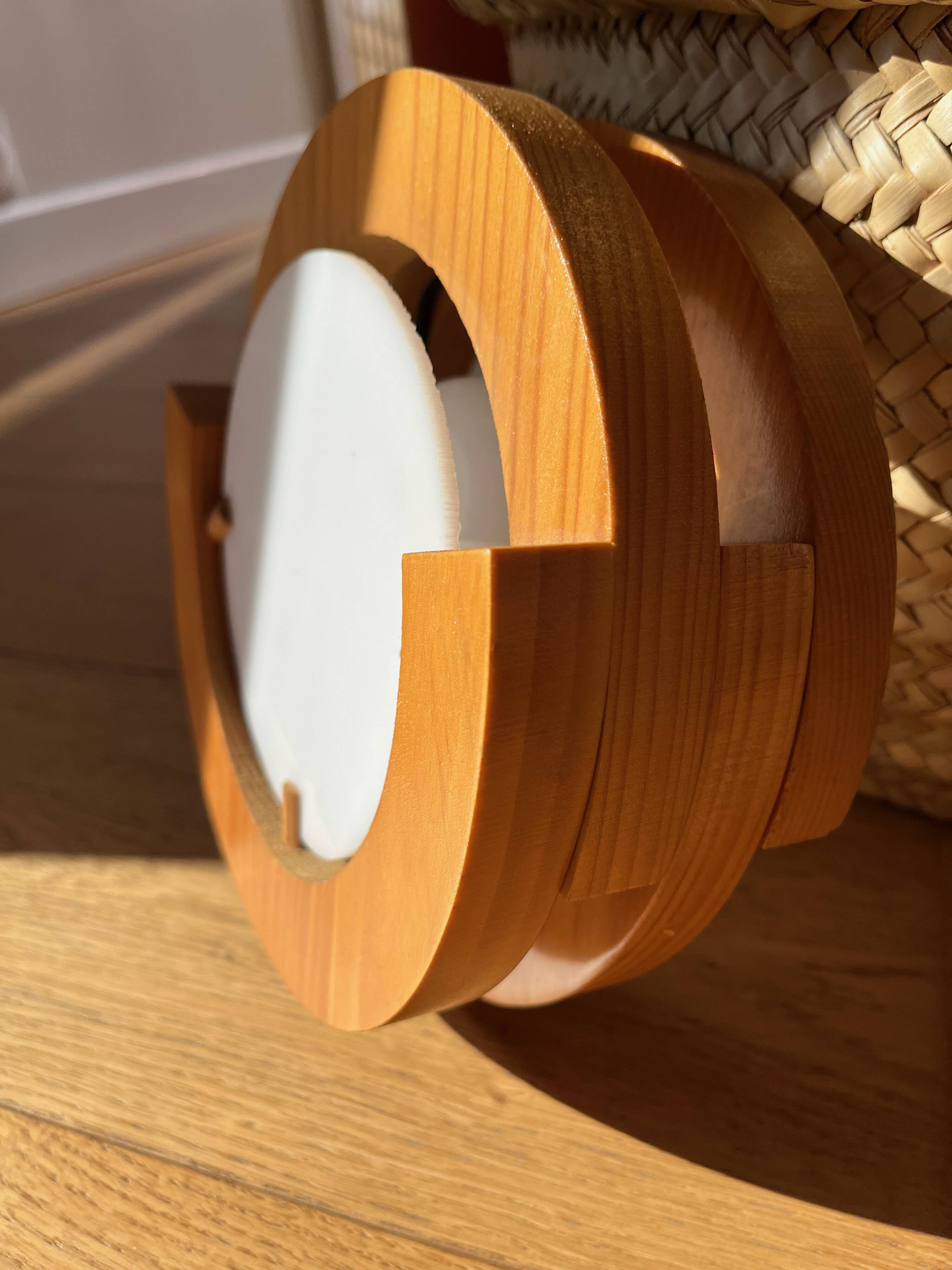 Round pine and plexiglass wall light, 1970s