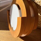 Round pine and plexiglass wall light, 1970