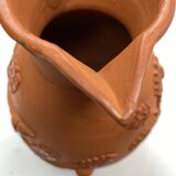 Vintage terracotta jug vase with plant ornament