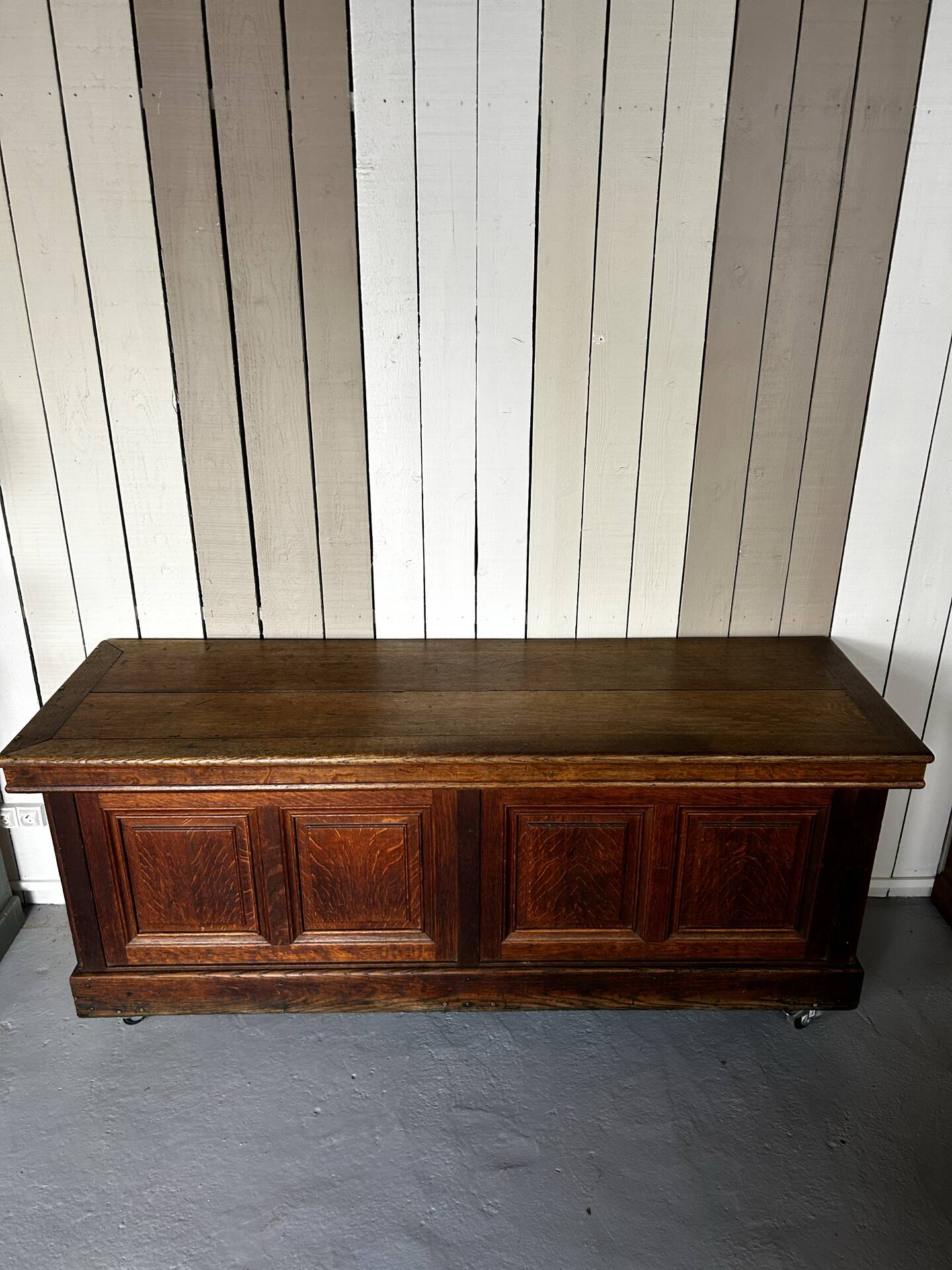 Large antique haberdashery counter in oak