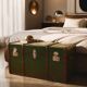 Vintage wooden and metal green travel trunk, circa 1930.