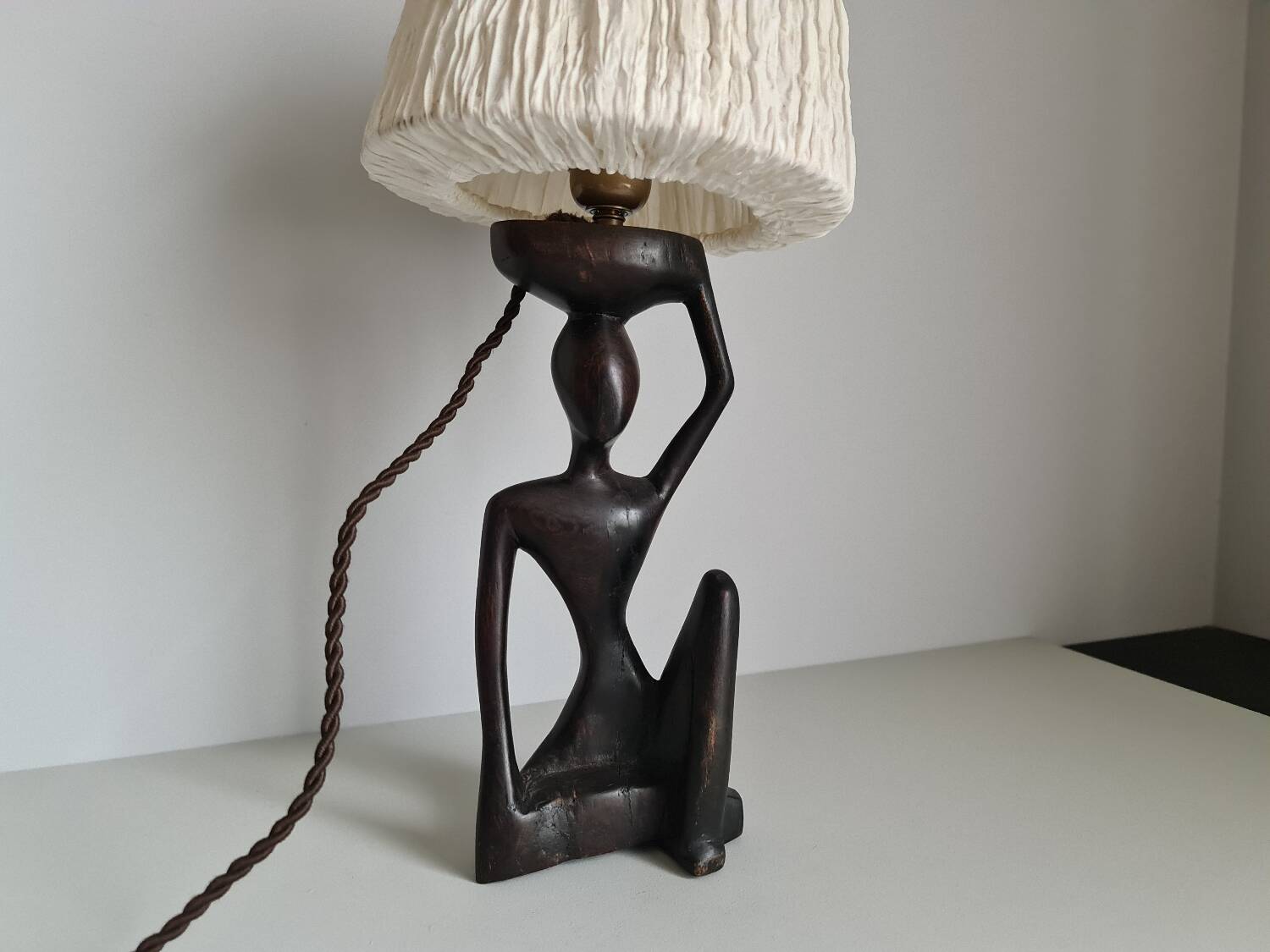 Ebony lamp with seated woman / 1930s