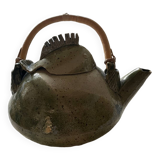 Handmade ceramic teapot with green fish and bamboo