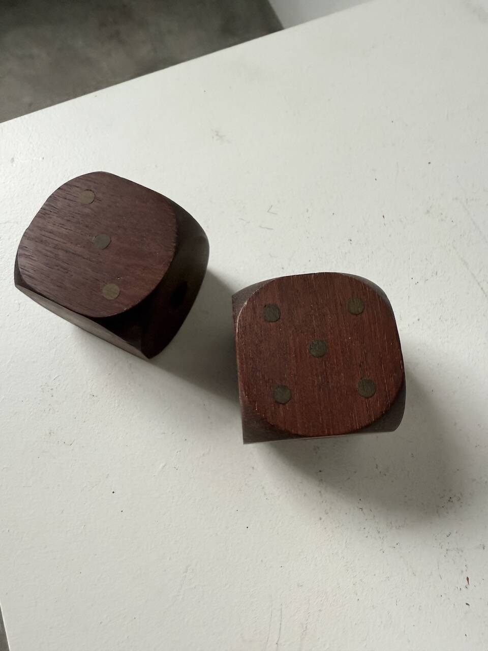 Pair of 1960s teak and brass "dice" candlesticks