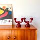 pair of burgundy enameled ceramic candlesticks / candelabras signed 1949