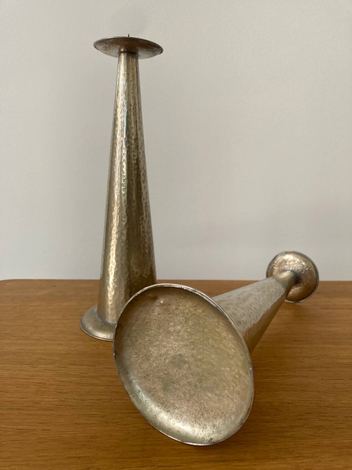 Pair of hammered metal candlesticks