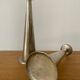 Pair of hammered metal candlesticks