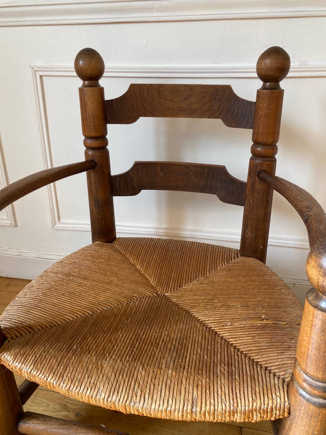 Straw and turned wood fireplace armchair in the style of Charles Dudouyt